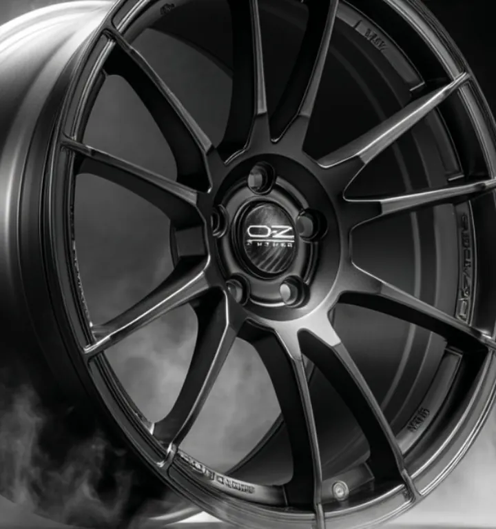 After: the same wheel model in an ad scene with smoke and side light