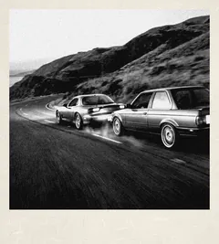 Polaroid: two cars drifting on a mountain road